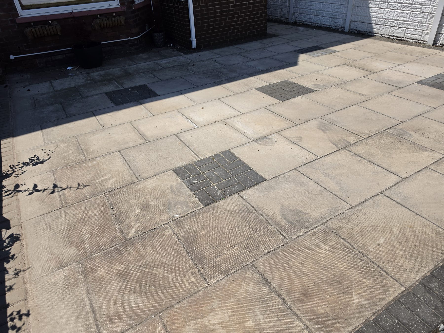 Before patio and driveway pressure washing in Southport by Evans Exterior Services